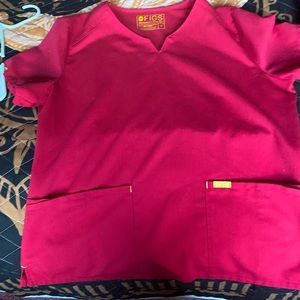 A set of figs scrubs. Beautiful bright pink in like new condition.